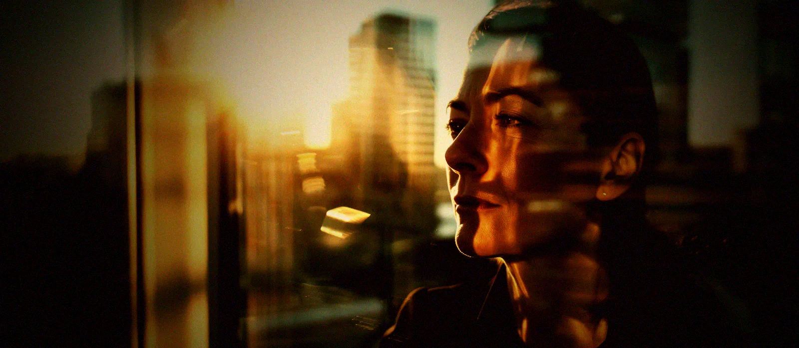 A senior manager stands at an office window, weighing whether the AI governance policy on her desk would survive an actual test.