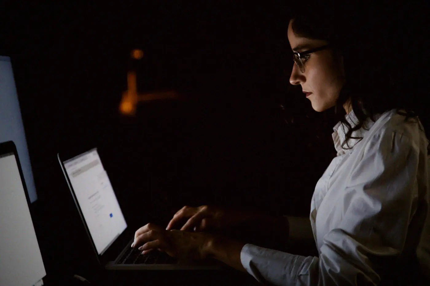 A manager working late at a laptop, checking a certification deadline that runs from her own account date rather than a national one.