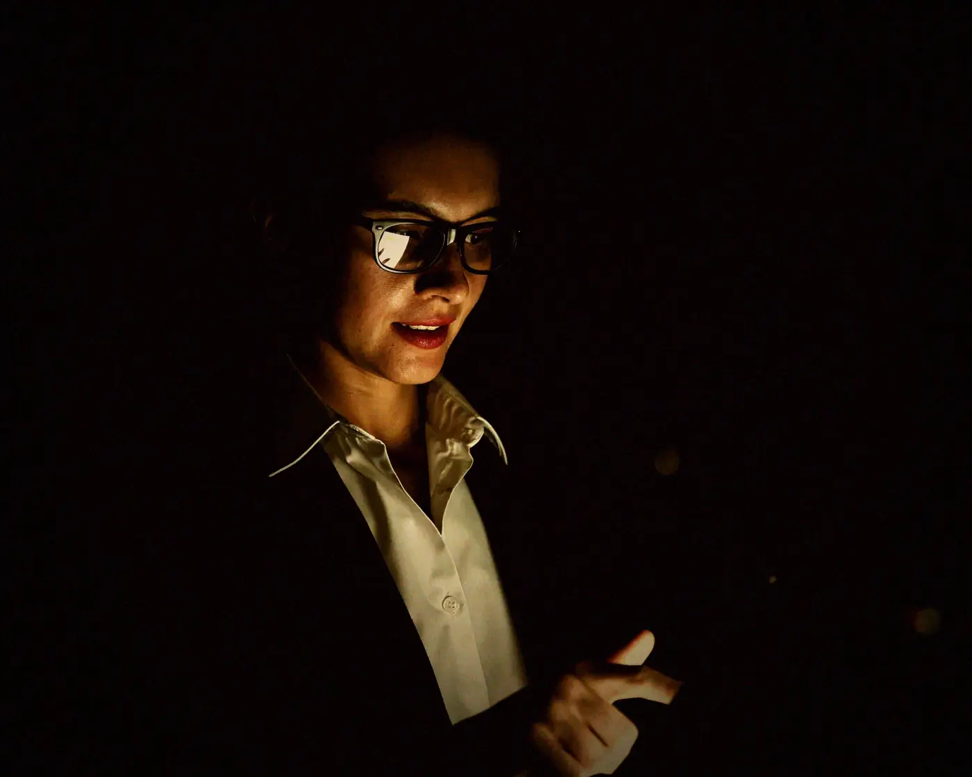 An employee working late in a small office, the kind of two-person firm that can hold a login to a national register.
